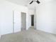 A bright bedroom features neutral carpet, closet and bathroom access, and lots of natural light at 11037 Bagley Aly, Windermere, FL 34786
