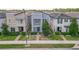 Two-story home with a modern exterior, green lawn, and beautiful landscaping at 11037 Bagley Aly, Windermere, FL 34786