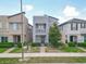 Street view of a two-story home featuring a modern facade and manicured lawn at 11037 Bagley Aly, Windermere, FL 34786