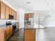 Open kitchen featuring granite countertops, stainless steel appliances and a large island at 11037 Bagley Aly, Windermere, FL 34786