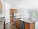 Well-equipped kitchen with stainless steel appliances, granite counters, and a view to the living room at 11037 Bagley Aly, Windermere, FL 34786