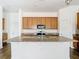 Large kitchen island with granite counters and stainless steel appliances at 11037 Bagley Aly, Windermere, FL 34786