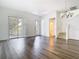 Bright living area with wood floors, featuring a staircase and views of the community's green spaces at 11037 Bagley Aly, Windermere, FL 34786