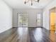 Bright living room with modern flooring and doors to the outside patio and balcony at 11037 Bagley Aly, Windermere, FL 34786