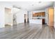 Spacious living room showcases modern flooring and flows into kitchen and staircase at 11037 Bagley Aly, Windermere, FL 34786