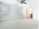 Main bedroom featuring carpet flooring, a ceiling fan, and ensuite bathroom access at 11037 Bagley Aly, Windermere, FL 34786
