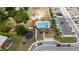 Aerial view showcasing community pool, playground, and manicured landscaping at 1113 Merrill St, Davenport, FL 33837