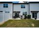 Fenced backyard featuring a patio set, grill, and green lawn at 1113 Merrill St, Davenport, FL 33837
