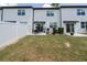 Large fenced backyard with patio, lawn, and attractive landscaping details at 1113 Merrill St, Davenport, FL 33837