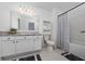 Clean bathroom with modern fixtures, shower, and ample storage space at 1113 Merrill St, Davenport, FL 33837