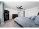 Bright bedroom with comfortable bedding, ceiling fan, and modern furnishings at 1113 Merrill St, Davenport, FL 33837