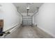 Spacious, empty garage interior with clean concrete floor and white walls at 1113 Merrill St, Davenport, FL 33837