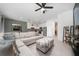 Spacious living room that flows seamlessly into the kitchen, featuring a comfortable sectional at 1113 Merrill St, Davenport, FL 33837
