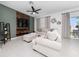Bright and airy living room featuring modern decor, a plush sectional and a large window at 1113 Merrill St, Davenport, FL 33837