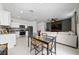 Open-concept living room and kitchen area with modern decor and neutral color palette at 1113 Merrill St, Davenport, FL 33837