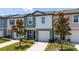 Exterior view of an inviting townhome with a well-kept lawn and a private driveway at 1113 Merrill St, Davenport, FL 33837