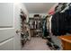 Organized walk-in closet with ample storage shelves and hanging racks at 1113 Merrill St, Davenport, FL 33837