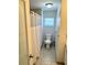 Bright bathroom with a shower, toilet and tile flooring for easy cleanup and a fresh look at 1126 Orwell Ave, Orlando, FL 32809