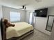 Cozy bedroom with neutral paint, ceiling fan, and tile floors at 1126 Orwell Ave, Orlando, FL 32809