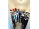 Well-organized walk-in closet featuring ample storage space and stylish shelves at 1126 Orwell Ave, Orlando, FL 32809
