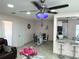 Open floor plan showcasing the dining room with its chandelier and tile flooring at 1126 Orwell Ave, Orlando, FL 32809