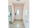 Inviting entryway featuring neutral tile flooring and a stylish front door at 1126 Orwell Ave, Orlando, FL 32809