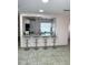 Kitchen bar with seating, granite countertop and track lighting providing ample light for cooking at 1126 Orwell Ave, Orlando, FL 32809