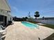Sparkling in-ground pool with a spacious concrete patio and a backyard at 1126 Orwell Ave, Orlando, FL 32809