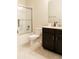 Bathroom featuring a combination tub and shower with glass doors, tile flooring, and vanity with sink at 11378 Whistling Pine Way, Orlando, FL 32832