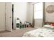 bedroom featuring a floor bed with dinosaur bedding, decorative wood accent wall, and built in storage at 11378 Whistling Pine Way, Orlando, FL 32832
