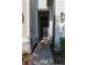 Inviting front door with stone accents and pathway leading to a beautifully landscaped entrance at 11378 Whistling Pine Way, Orlando, FL 32832