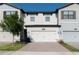 Charming townhome featuring a two-car garage and neat landscaping in a well-maintained community at 11378 Whistling Pine Way, Orlando, FL 32832