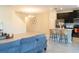 Spacious living area with modern kitchen featuring a breakfast bar and open layout at 11378 Whistling Pine Way, Orlando, FL 32832
