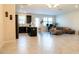 Bright open-concept living area featuring a kitchen with an island and a comfortable seating area at 11378 Whistling Pine Way, Orlando, FL 32832