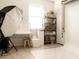 Bright studio space featuring hardwood floors, white backdrop, equipment, and shelving at 11378 Whistling Pine Way, Orlando, FL 32832