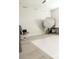 Bright studio space featuring hardwood floors, a grey rocking chair, and various studio lighting equipment at 11378 Whistling Pine Way, Orlando, FL 32832