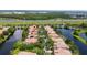 Aerial view of community with houses surrounding lake near highway at 12041 Kajetan Ln, Orlando, FL 32827