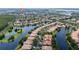 Community aerial view featuring houses, lakes, landscaping, and roadways at 12041 Kajetan Ln, Orlando, FL 32827