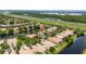 Aerial view featuring the house, lake, and landscaping at 12041 Kajetan Ln, Orlando, FL 32827