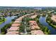A community aerial view showcasing homes, trees, and waterways at 12041 Kajetan Ln, Orlando, FL 32827