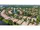 Expansive aerial view overlooking a lakeside community surrounded by lush greenery at 12041 Kajetan Ln, Orlando, FL 32827