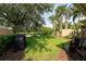 A well-maintained lawn leads to a serene pond view, perfect for enjoying peaceful outdoor moments at 12041 Kajetan Ln, Orlando, FL 32827