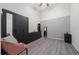 Spacious bedroom featuring a large black wardrobe, neutral gray walls, and matching accents at 12041 Kajetan Ln, Orlando, FL 32827