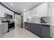 Contemporary kitchen boasts sleek cabinetry, stainless steel appliances, and granite countertops at 12041 Kajetan Ln, Orlando, FL 32827