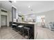 Well-designed kitchen island with granite countertops and barstool seating, perfect for casual dining at 12041 Kajetan Ln, Orlando, FL 32827
