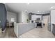 Bright kitchen with granite countertops, stainless steel appliances, and a dining area nearby at 12041 Kajetan Ln, Orlando, FL 32827