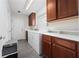 This laundry room offers ample storage with its white cabinets and includes a washer and dryer at 12041 Kajetan Ln, Orlando, FL 32827