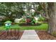 A vibrant community playground with colorful play structures, benches, and a cozy playhouse at 12041 Kajetan Ln, Orlando, FL 32827