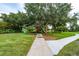 Community playground with mature trees offering shade on the playground area at 12041 Kajetan Ln, Orlando, FL 32827