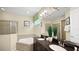 Bright bathroom boasts a double vanity, soaking tub, and shower at 1228 Castle Pines Ct, Reunion, FL 34747